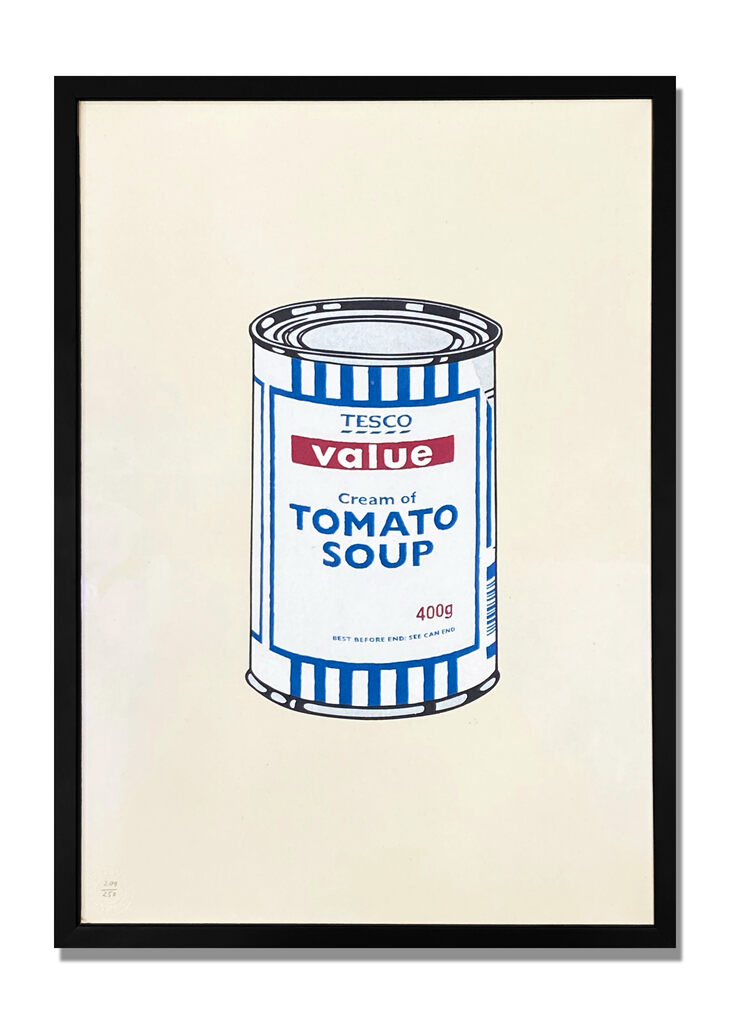 A Tesco Value cream of tomato soup can with blue-and-white stripes and a red Value label against a cream background.