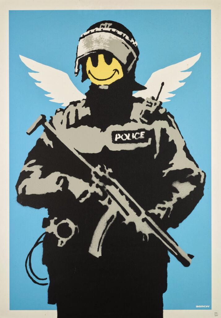 Armed black-and-grey police figure with a yellow smiley face and white wings against blue.