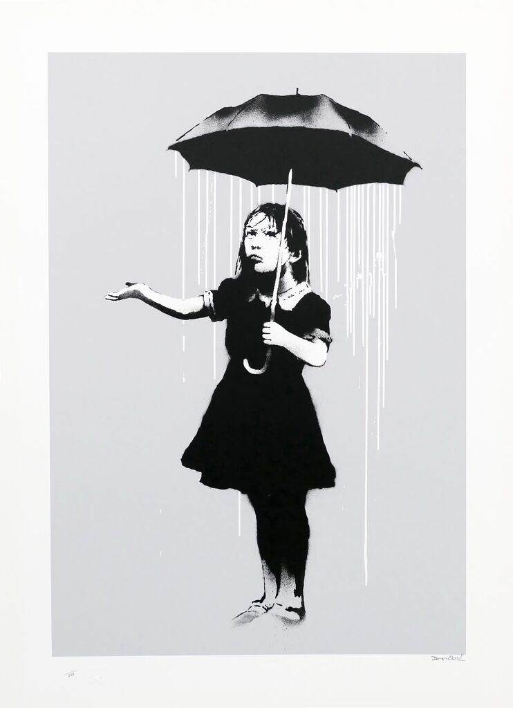 A girl holds a black umbrella with rain falling from beneath it, extending her other hand beyond its edge, palm upwards.