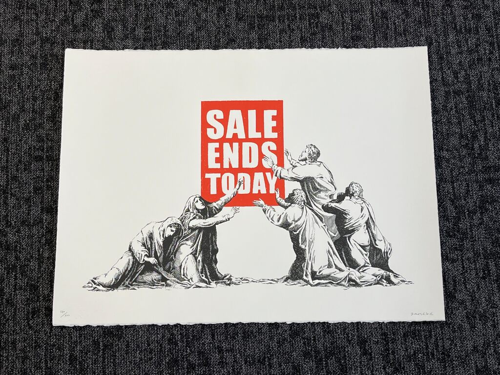 A loose print shows kneeling figures reaching toward a red SALE ENDS TODAY sign.