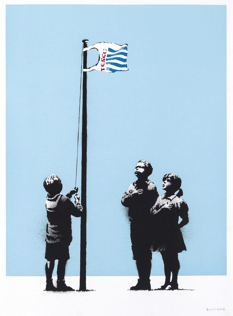 Three children stand beneath a Tesco carrier bag flying from a flagpole against blue; one holds the rope while the other two place hands against their chests.