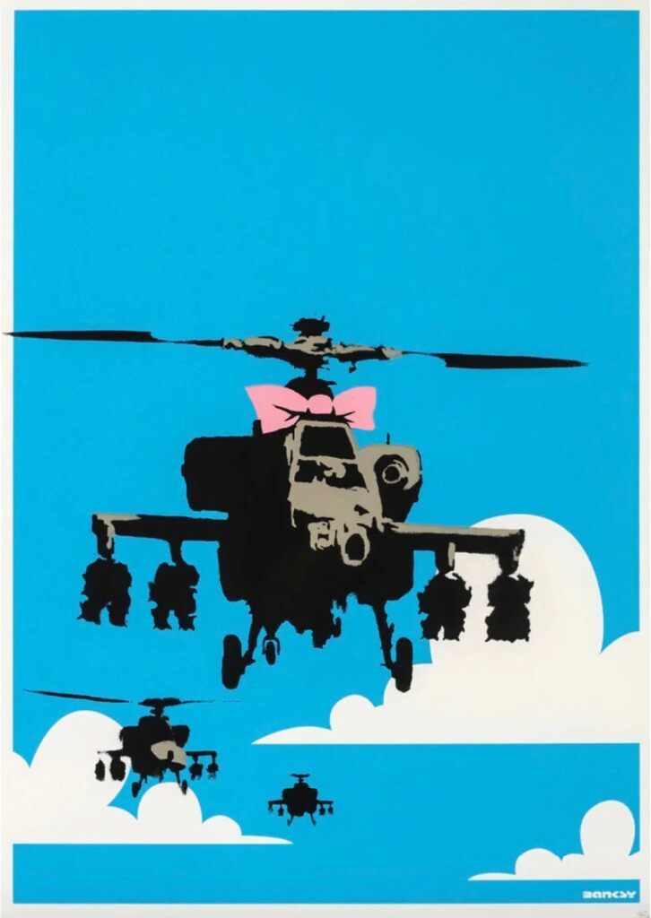 Three military helicopters appear among white clouds against bright blue; the large foreground helicopter has a pink bow above its cockpit.