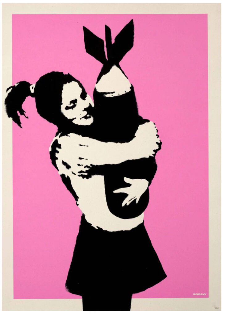 A girl hugs a large black bomb against bright pink.
