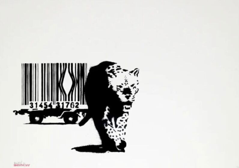 A black-and-white leopard walks out in front of a wheeled cage whose bars form a barcode, with a gap in the bars behind it.