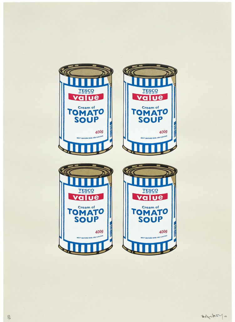 Four blue-striped tomato soup cans arranged in two rows on cream.