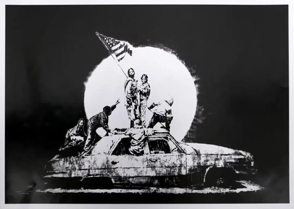 Black-and-white figures on a wrecked car holding a flag before a pale circle against black.
