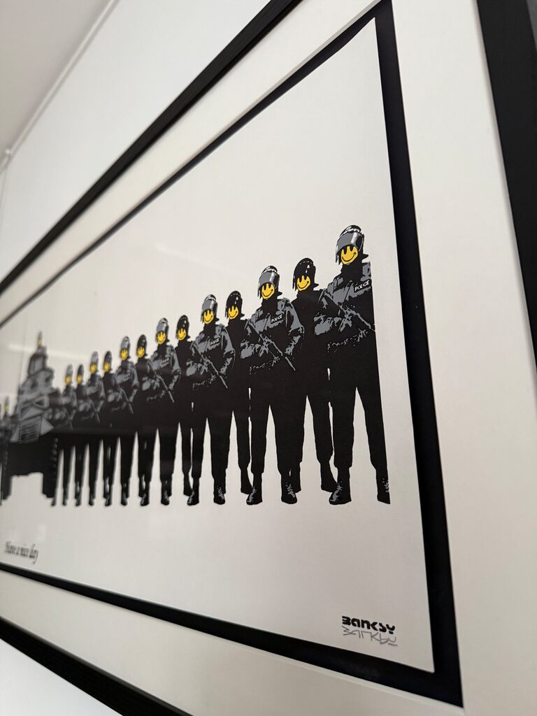Angled framed row of uniformed figures with yellow smiley faces.